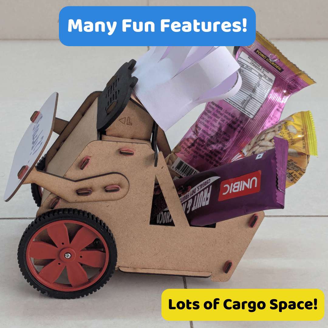 Cardboard toy vehicle with snacks on wheels, labeled 'Many Fun Features!' and 'Lots of Cargo Space!'.